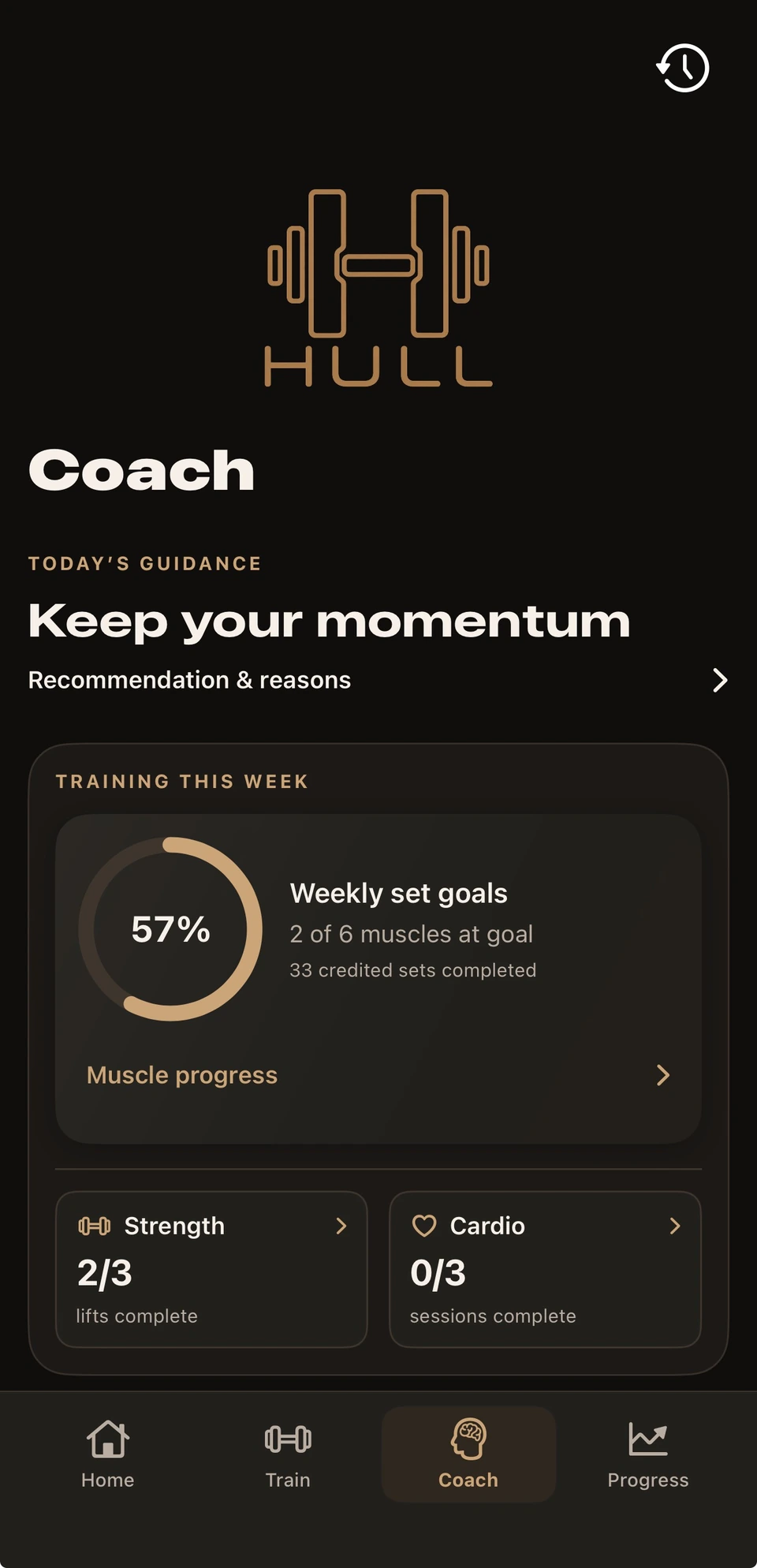Dark-mode Coach with weekly muscle set goals and compact Strength and Cardio completion cards